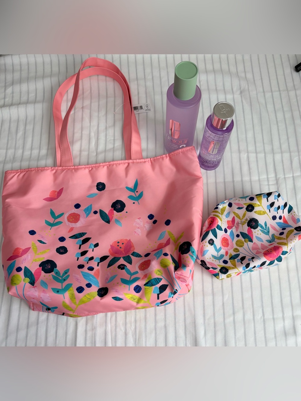 Clinique Pink Clear Skincare Bottle on Pink Floral Pouch